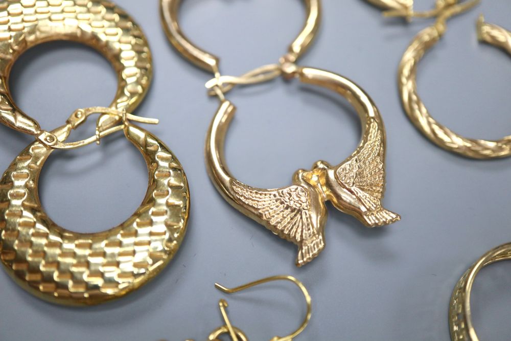 A pair of 9ct gold Greek Key pattern half-hoop earrings and five other pairs of 9ct gold earrings,